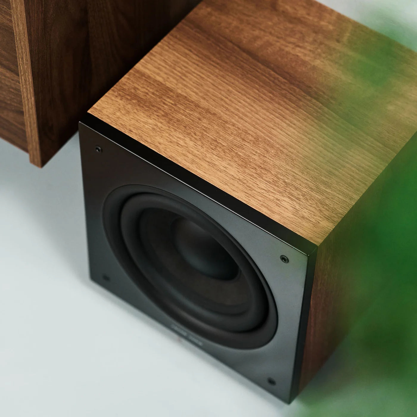 Argon Audio Malmö Sub 8 subwoofer with black finish, compact design, and speaker grille, designed for deep bass sound.