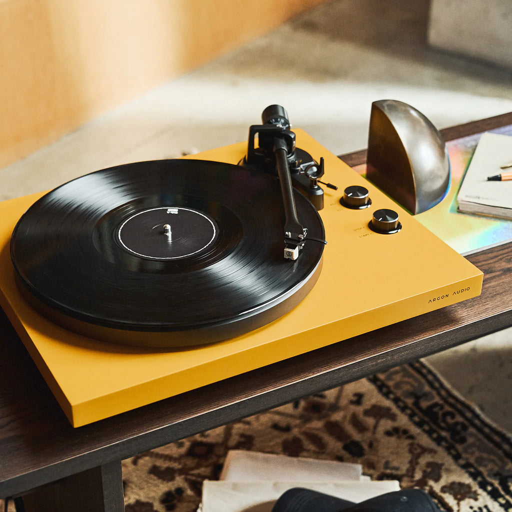 Argon Audio TT MK2 turntable with wooden plinth and tonearm, showcasing its sleek, modern design and control knobs.