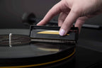 Close-up of the AudioQuest Gold Anti-Static Brush for record cleaning, featuring fine bristles for removing static and dust from vinyl records.
