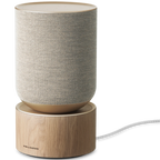 Bang & Olufsen Beosound Balance wireless speaker with natural wood finish and sleek design, showcasing its modern aesthetic.