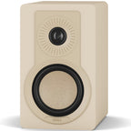 DALI Kupid passive bookshelf speakers with caramel white grille, showcasing sleek design and compact size for home audio.