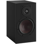 Black DALI Opticon 2 MK2 passive bookshelf speakers showing sleek design and front grille in a modern setup.