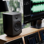 FiiO SP5 desktop speakers with sleek design and compact size, featuring dual drivers and modern finish for high-quality audio.