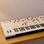 Side view of the Frap Tools Magnolia keyboard synthesizer showing its sleek design and control interface.
