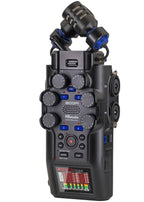 Zoom H6 studio digital recorder with multiple input jacks and a large LCD screen, shown from a front angle.