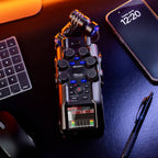 Zoom H6 Digital Recorder with RF shielding, shown with protective shield covering the device for noise reduction and improved audio quality.
