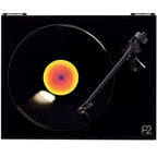 Rega Planar 2 turntable with Nd3 cartridge, featuring a sleek design and tonearm, on a wooden stand.