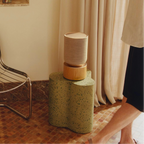 Bang & Olufsen Beosound Balance wireless speaker in a modern living room setting, showcasing its sleek design and premium build.