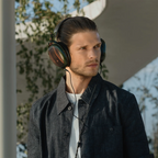 Meze Audio Strada wired headphones with sleek black design and over-ear cushions, showing the high-quality ear cups and headband.