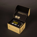 Open packaging of the Sim'n Tonic Nome II MIDI interface showing the device and its connecting ports.