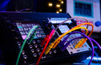 Semi-modular synthesizer 1010music Bitbox MK2 with colorful knobs and interface, designed for music production and sound design.