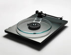 Rega Planar 3 RS turntable with aluminum plinth and Nd5 cartridge, shown from the side without lid, featuring a sleek platter.