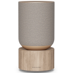 Bang & Olufsen Beosound Balance wireless speaker in natural oak finish, showcasing its sleek, modern design and front view.