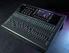 Allen & Heath Qu-6D digital mixer with touchscreen interface and multiple input channels, displayed on a professional audio setup.