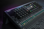 Allen & Heath Qu-6D digital mixer with touchscreen interface and multiple input controls in a professional audio setup.