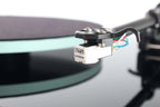 Rega Planar 2 turntable with Nd3 cartridge, showcasing its sleek design and tonearm in a close-up view.