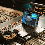 Fender Studio Pro (Student) DAW software box with audio interface and keyboard controller for music production.
