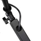 Shure SH-BROADCAST2 broadcast microphone arm mounted on a desk, adjustable with cable management, for professional audio setup.