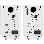 FiiO SP5 desktop speakers with black finish, compact design, and control knobs on the front panel, placed on a wooden surface
