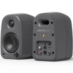 Kanto Audio UKI desktop speakers with sleek black design, featuring dual speaker units and control knobs on a modern workspace.