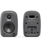 Kanto Audio UKI desktop speakers with dual straight design, compact black speakers for high-quality audio on a workspace.