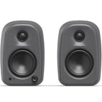 Kanto Audio UKI desktop speakers shown from the front, with a sleek black design and compact rectangular shape.