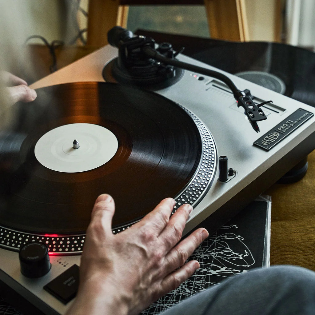 Vestlyd Pro T1 DJ turntable with sleek black design and control knobs, ideal for professional DJ setups and music mixing.
