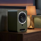 Fyne Audio Cubitt 5 active bookshelf speakers with sleek black finish and modern design, displayed on a wooden surface.