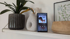 FiiO M23 portable music player with a sleek display, control buttons, and headphone jack, showcasing its modern compact design.