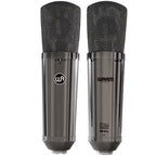 Pair of Warm Audio WA-87 R2 TS stereo condenser microphones with black metal bodies and vintage-style grille for professional audio recording.