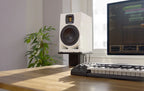 Adam Audio A7V active nearfield studio monitor speakers, 25th anniversary limited edition on a desk.