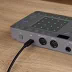 AlphaTheta ChordCat DJ pad controller, USB cable connected to rear ports.