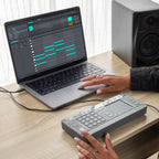 AlphaTheta ChordCat DJ pad controller, used beside laptop with DAW.