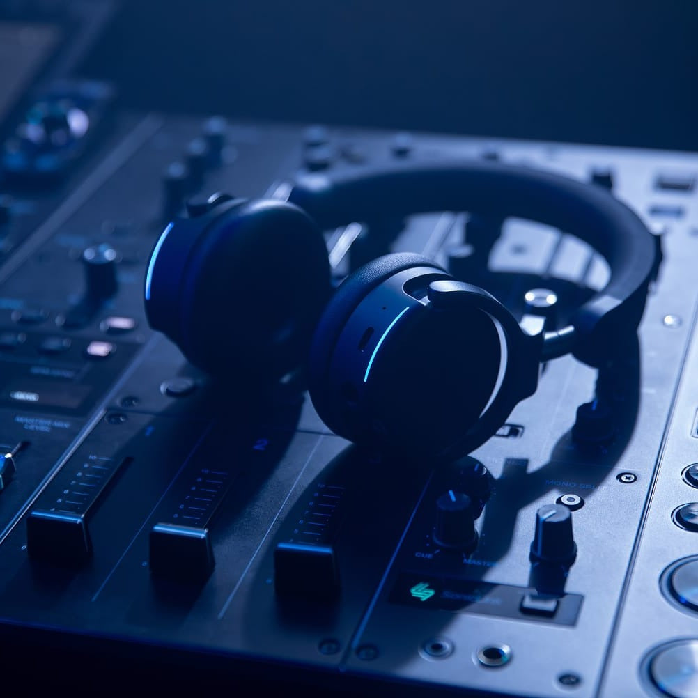 AlphaTheta HDJ-F9 resting on a DJ mixer