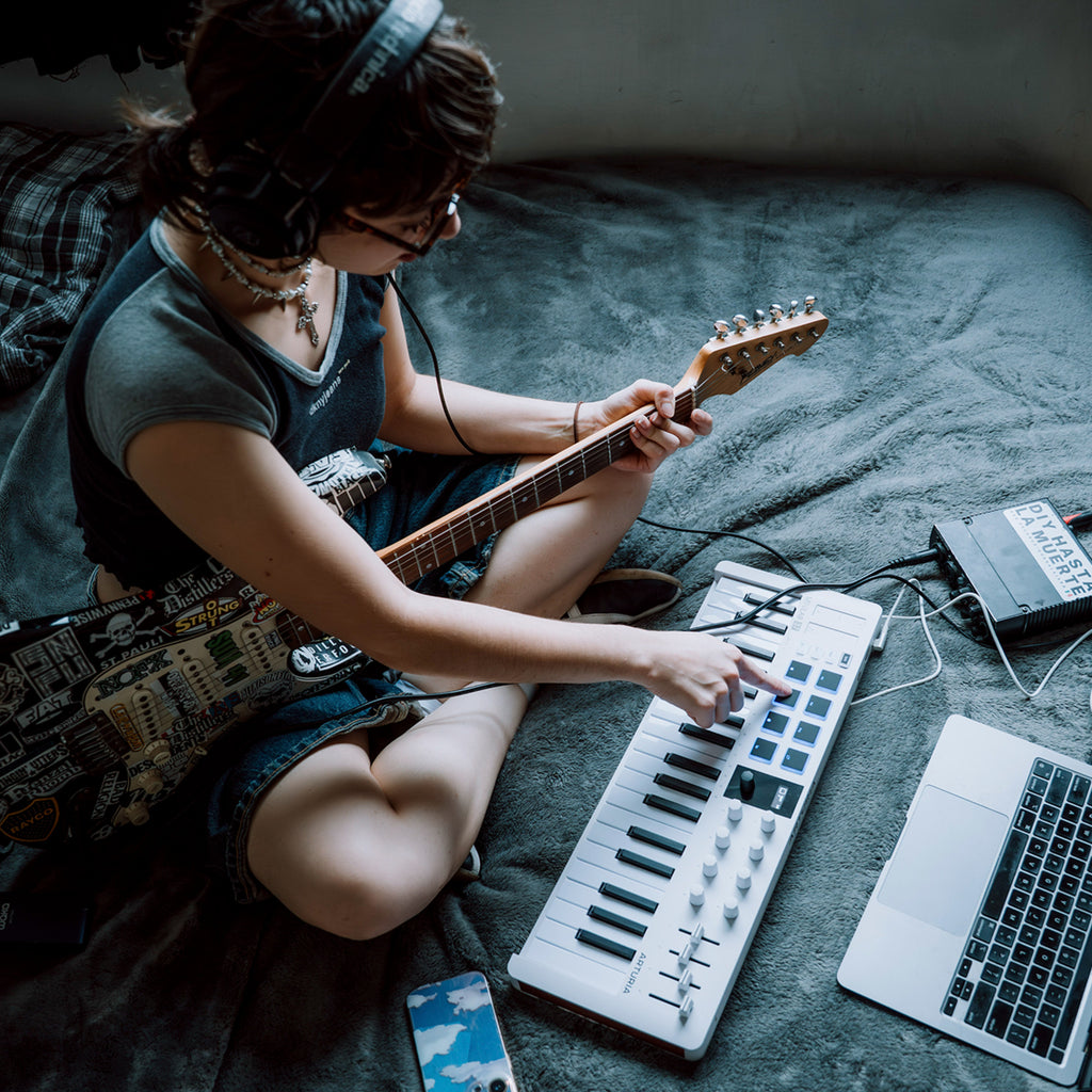 Arturia MiniLab 37 with guitar and laptop