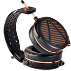 Audeze LCD-5s wired headphones with open-back design and sleek black ear cups on a wooden surface.
