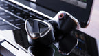 FiiO FH19 in-ear headphones with black ear tips and sleek design, shown from front view with cable attachment visible.