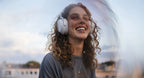 Beyerdynamic Aventho 300 wireless headphones worn by a dancing girl, showcasing sleek design and comfortable fit.