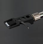 Tonar DJ Headshell for turntable cartridges, showing the lightweight metal design and connection pins for DJ and audiophile setups.