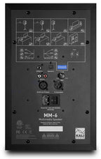 Kali Audio MM-6 active nearfield monitors with rear ports and control panels, shown from the back in a studio setup.