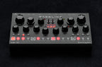 Erica Synths Desktop Bassline DB-01 synthesizer with knobs and keyboard interface, compact desktop design for bassline sounds.