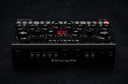 Erica Synths Desktop Bassline DB-01 synthesizer with knobs and patch points, compact desktop design for bass sounds.