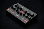 Erica Synths Desktop Bassline DB-01 synthesizer with knobs and keys, showcasing its compact design and control interface.