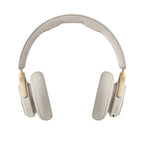 Bang & Olufsen Beoplay HX wireless headphones in gold tone, featuring over-ear design and sleek modern look.