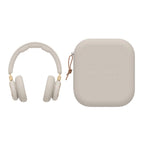 Gold-tone Bang & Olufsen Beoplay HX wireless headphones with carrying case, sleek design and premium audio quality.