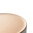 Bang & Olufsen Beosound Balance wireless speaker with white marble finish, showcasing sleek, modern design and premium craftsmanship.