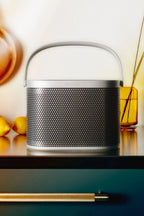 Bang & Olufsen Beosound A5 portable speaker in a sleek design, shown in a moodboard image highlighting its modern aesthetic.