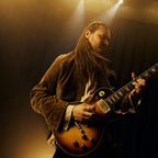 Beyerdynamic DT 30 IE in use, guitarist performing on stage with in-ear monitors