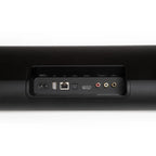 Bluesound Pulse Cinema soundbar with black connection panel, featuring audio ports and sleek TV speaker design.