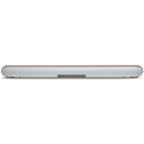 Bluesound Pulse Cinema Mini soundbar in ivory, rear view on a tabletop showing sleek design and speaker grille.